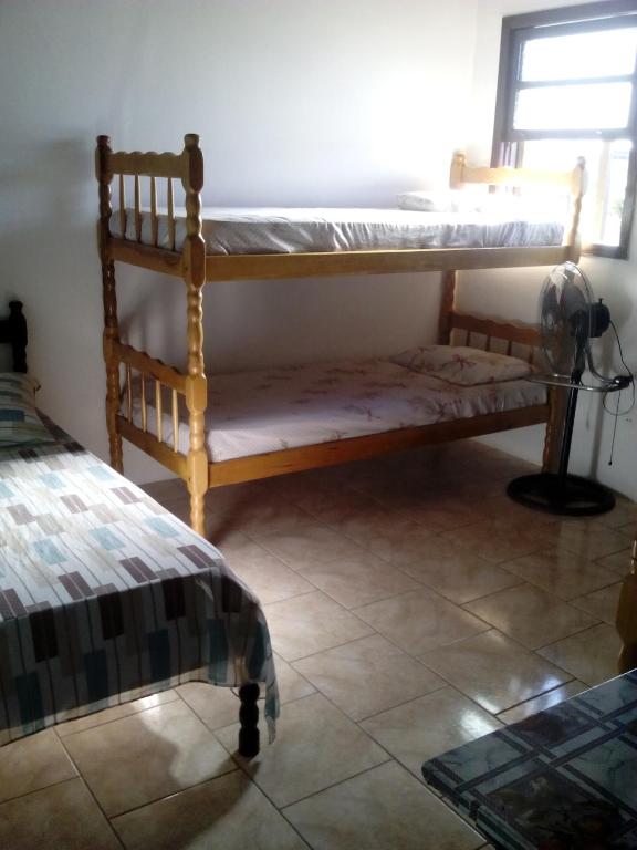 Postel nebo postele na pokoji v ubytování Hotel Pousada Guaratuba