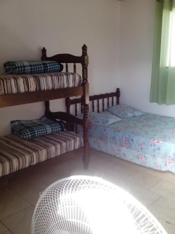 Postel nebo postele na pokoji v ubytování Hotel Pousada Guaratuba