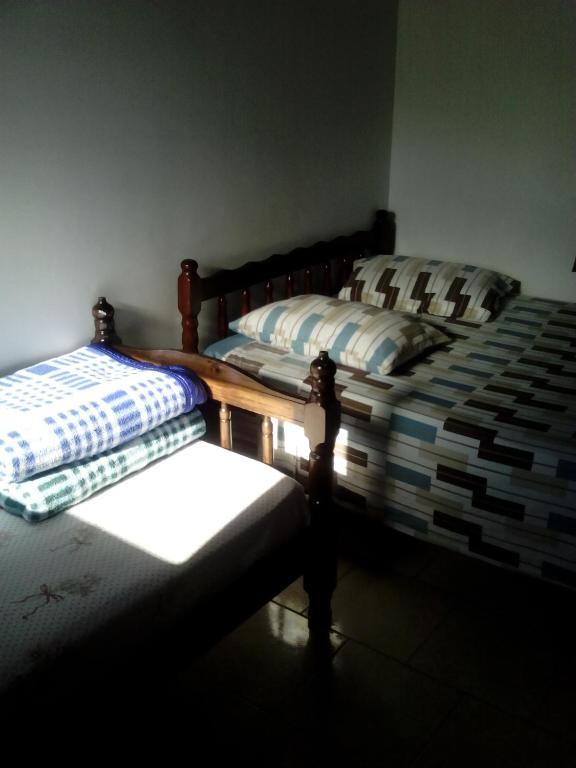 Postel nebo postele na pokoji v ubytování Hotel Pousada Guaratuba