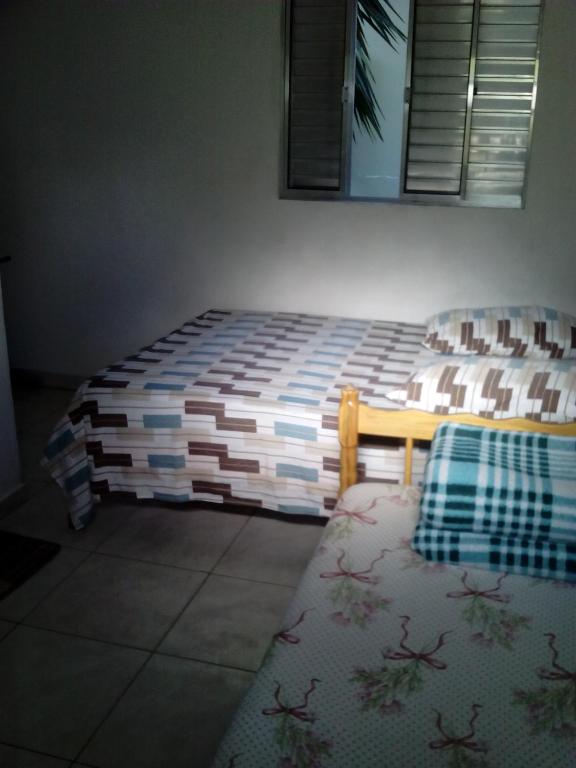 Postel nebo postele na pokoji v ubytování Hotel Pousada Guaratuba