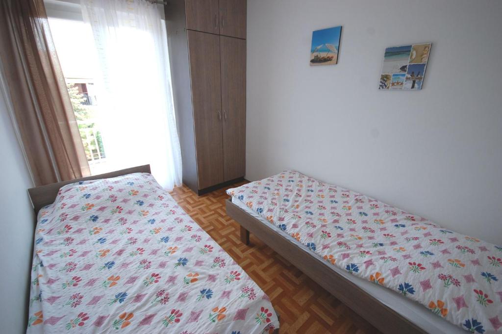 Posteľ alebo postele v izbe v ubytovaní Apartments Jakobi by El-Pi Tours