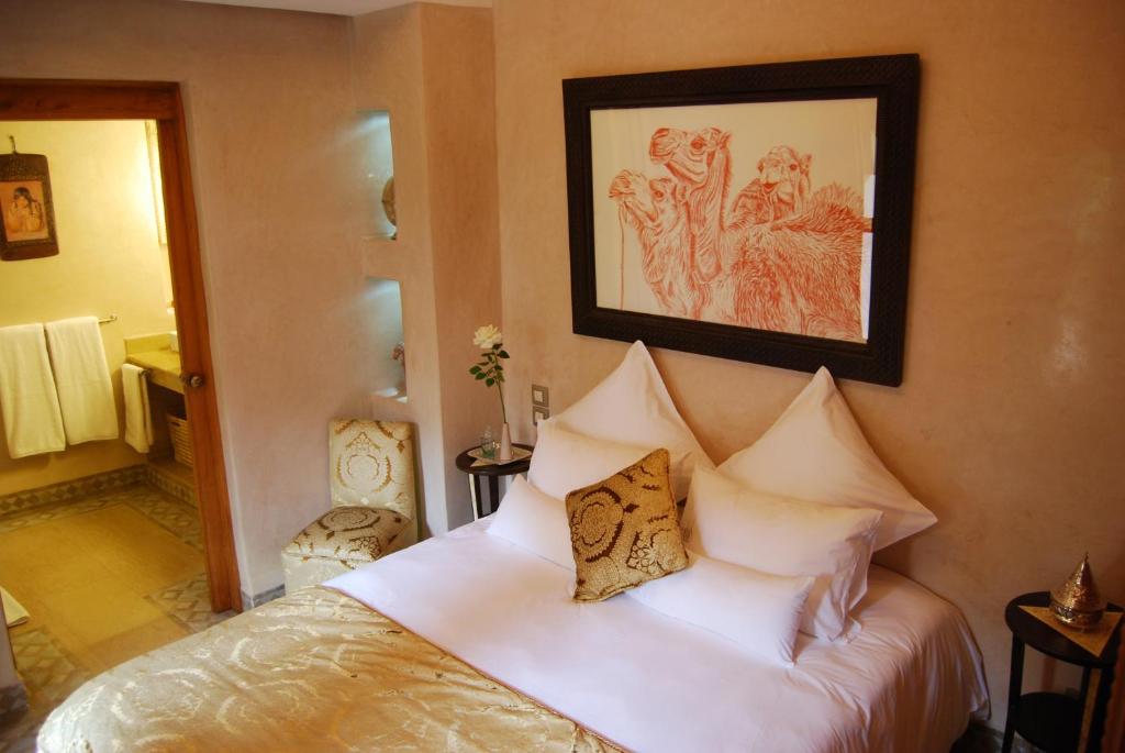 Postel nebo postele na pokoji v ubytování Riad Flam & Spa