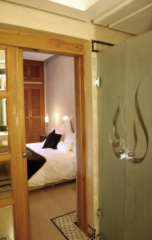 Postel nebo postele na pokoji v ubytování Riad Flam & Spa