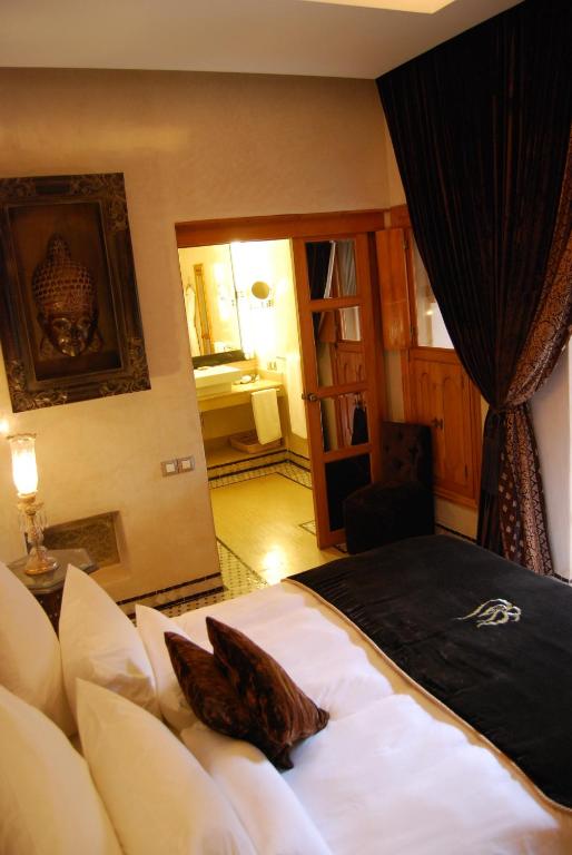 Postel nebo postele na pokoji v ubytování Riad Flam & Spa
