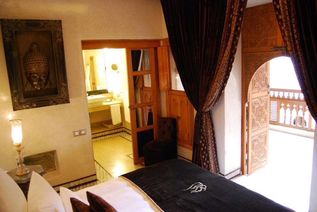 Postel nebo postele na pokoji v ubytování Riad Flam & Spa