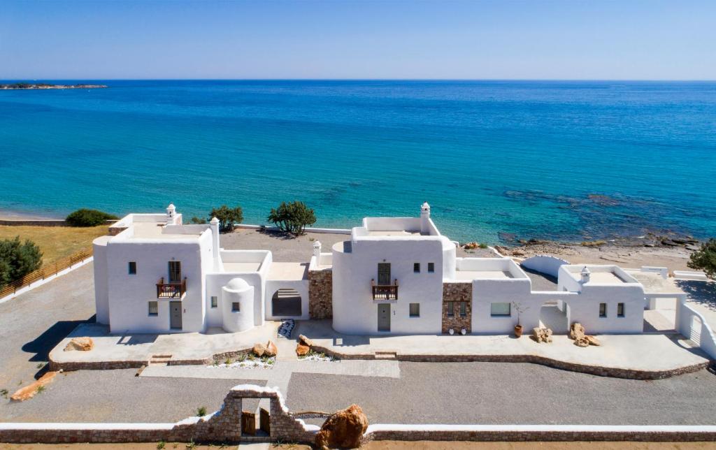 an aerial view of a white house by the ocean at Axiotheaton Villas in Pefki Rhodes