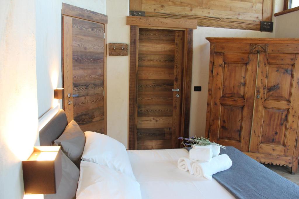 Postel nebo postele na pokoji v ubytování B&B Lo Matsòn