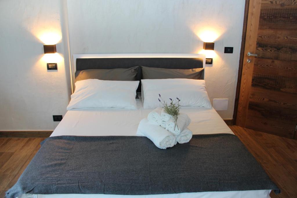 Postel nebo postele na pokoji v ubytování B&B Lo Matsòn