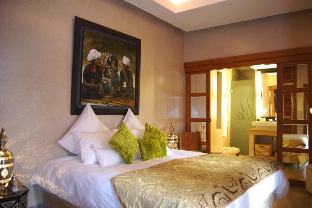 Postel nebo postele na pokoji v ubytování Riad Flam & Spa