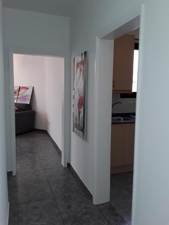 A bed or beds in a room at Central Seaview Apartment Puerto del Carmen