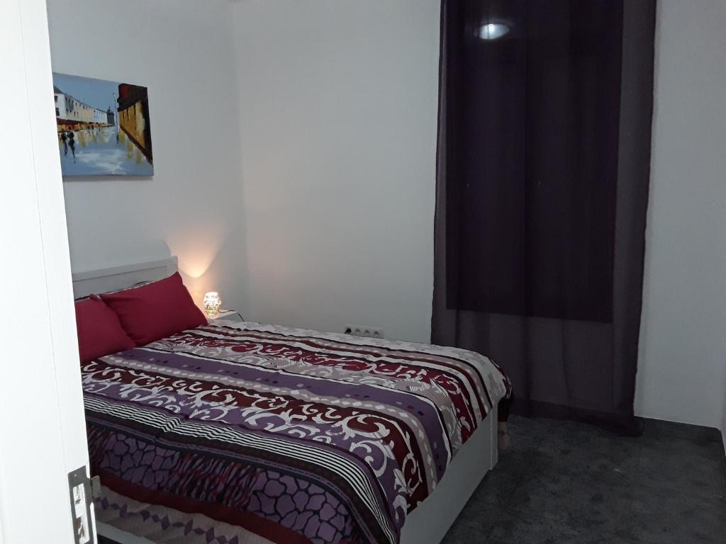 A bed or beds in a room at Central Seaview Apartment Puerto del Carmen
