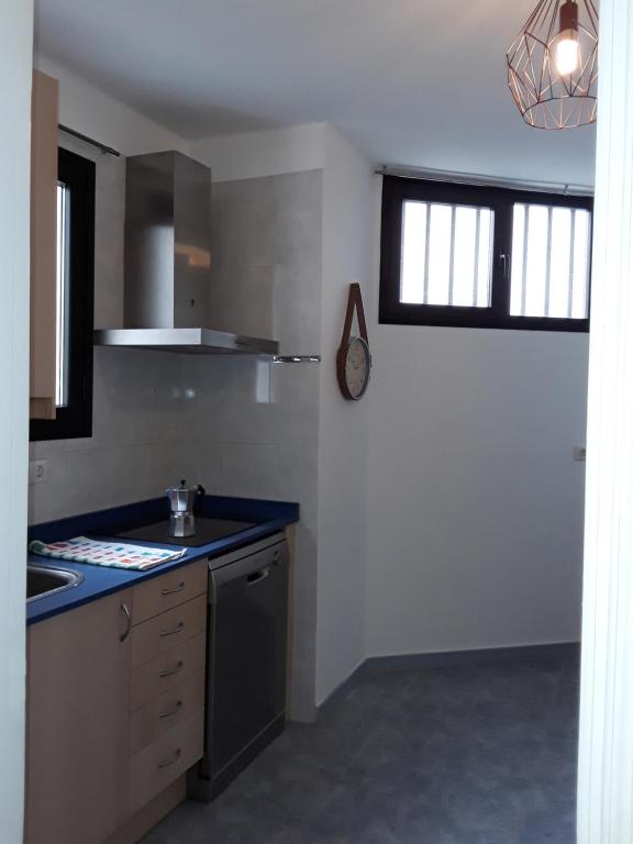 A kitchen or kitchenette at Central Seaview Apartment Puerto del Carmen