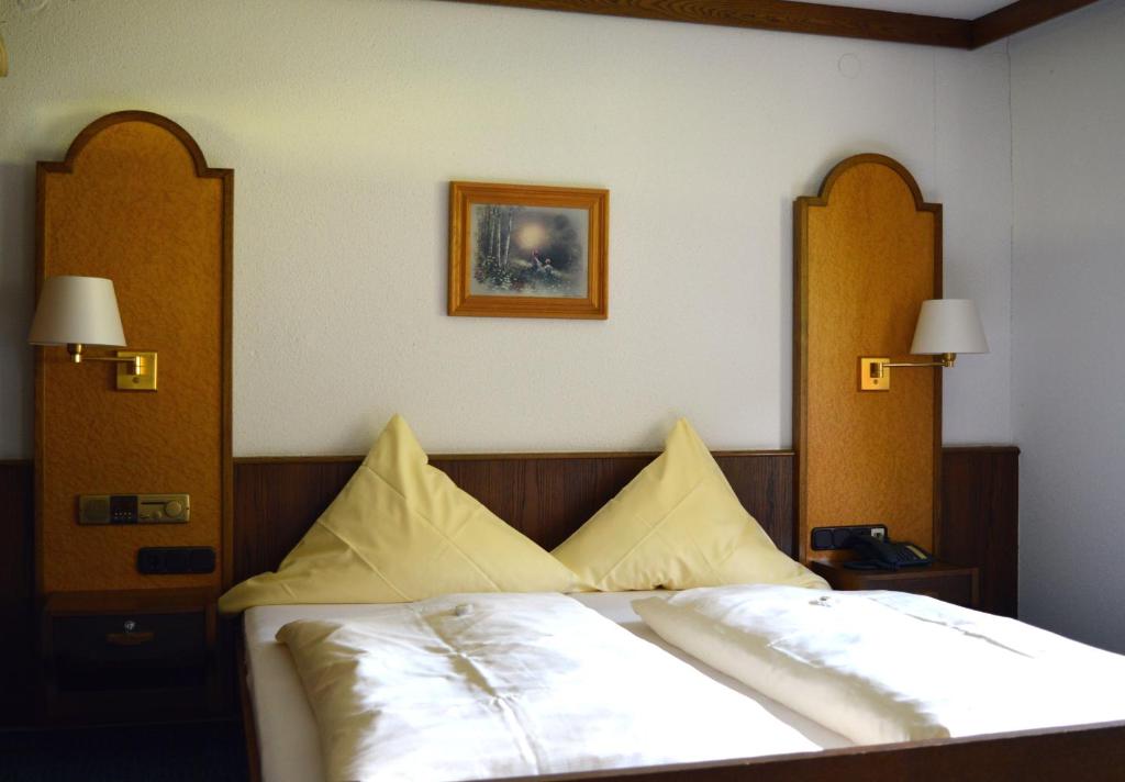 Postel nebo postele na pokoji v ubytování Natur & Wander Hotel Gassbachtal