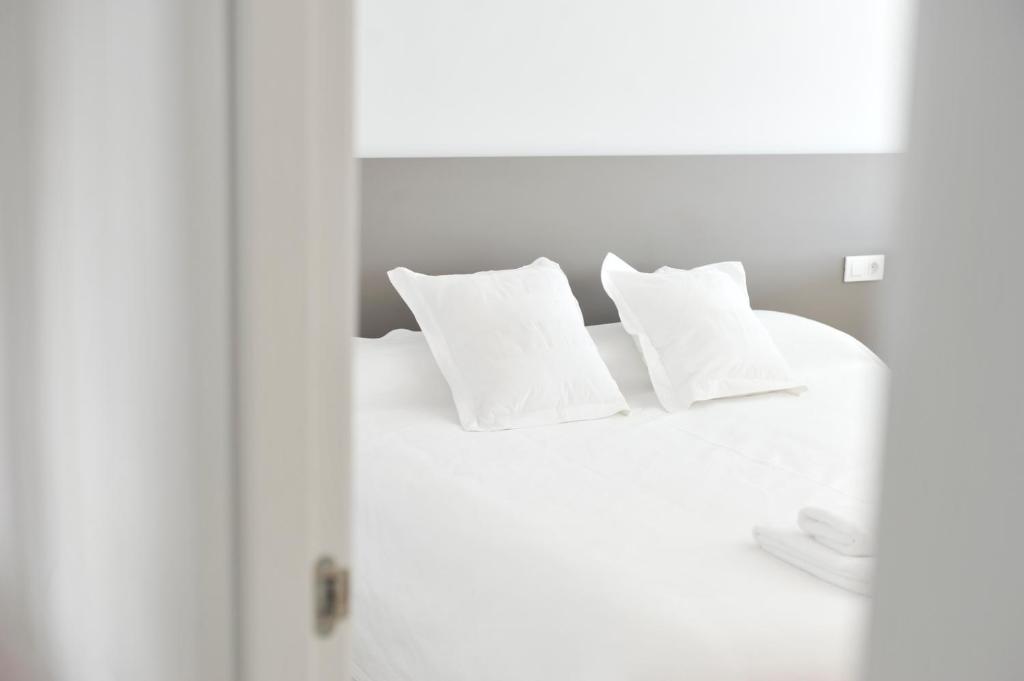 Postel nebo postele na pokoji v ubytování Smart Suites Albaicin