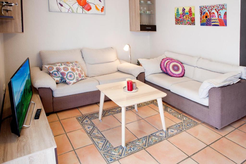 A seating area at Beachfront apartment in paradise