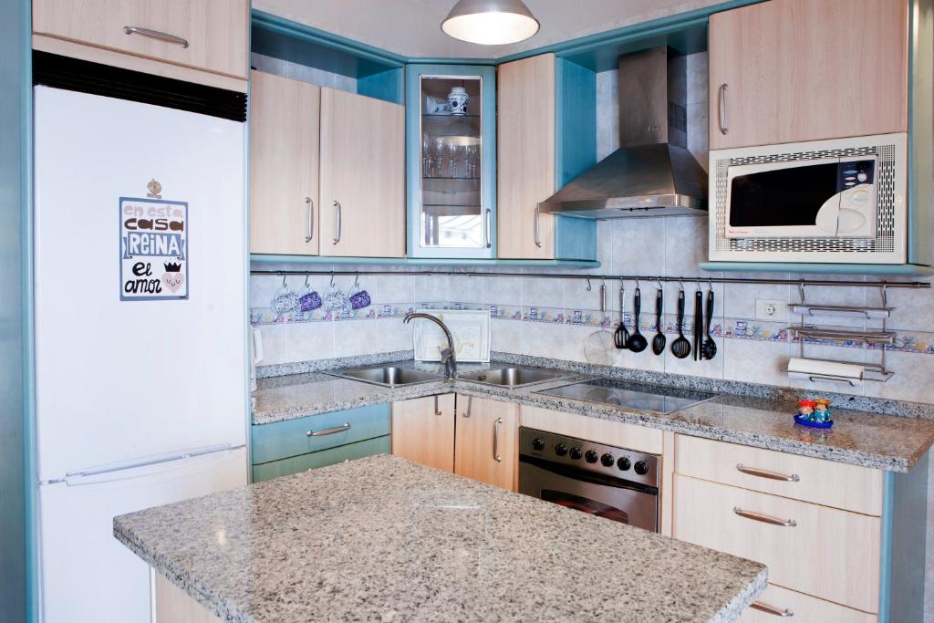 A kitchen or kitchenette at Beachfront apartment in paradise