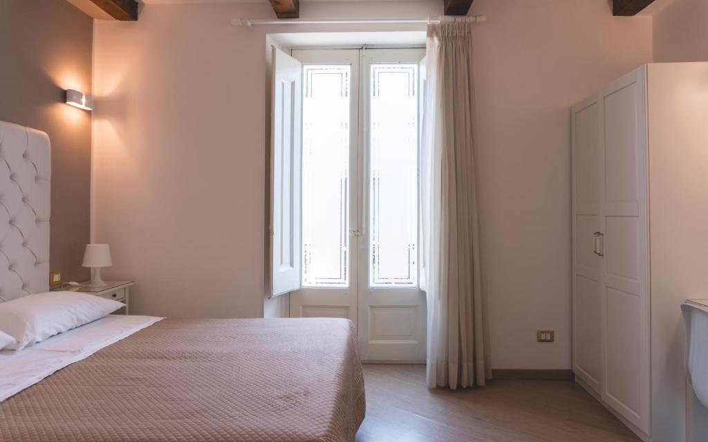 Postel nebo postele na pokoji v ubytování Fata34 Luxury B&B