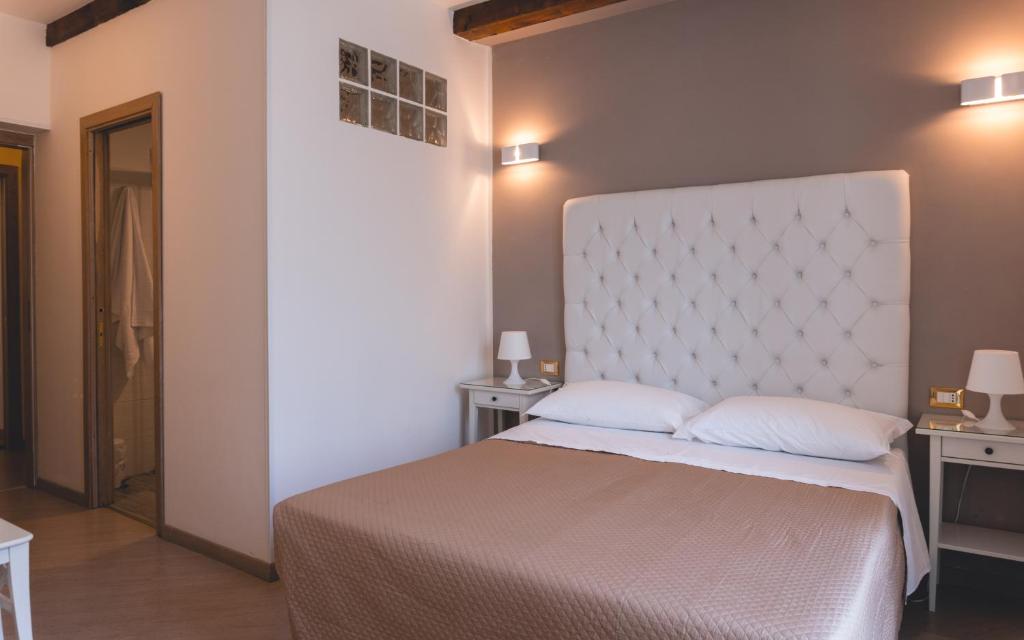 Postel nebo postele na pokoji v ubytování Fata34 Luxury B&B
