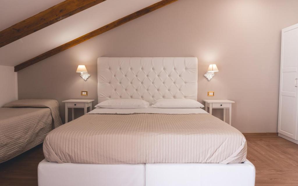 Postel nebo postele na pokoji v ubytování Fata34 Luxury B&B