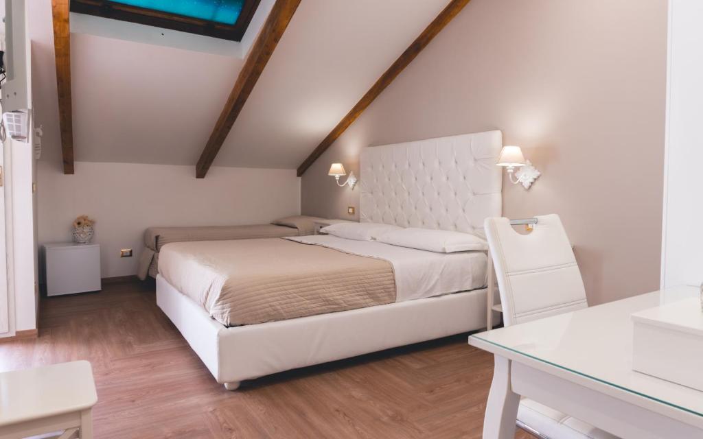 Postel nebo postele na pokoji v ubytování Fata34 Luxury B&B