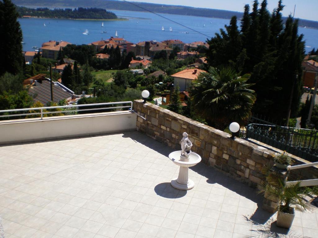 a view of a balcony with a statue on a table at Apartments Heidi in Portorož