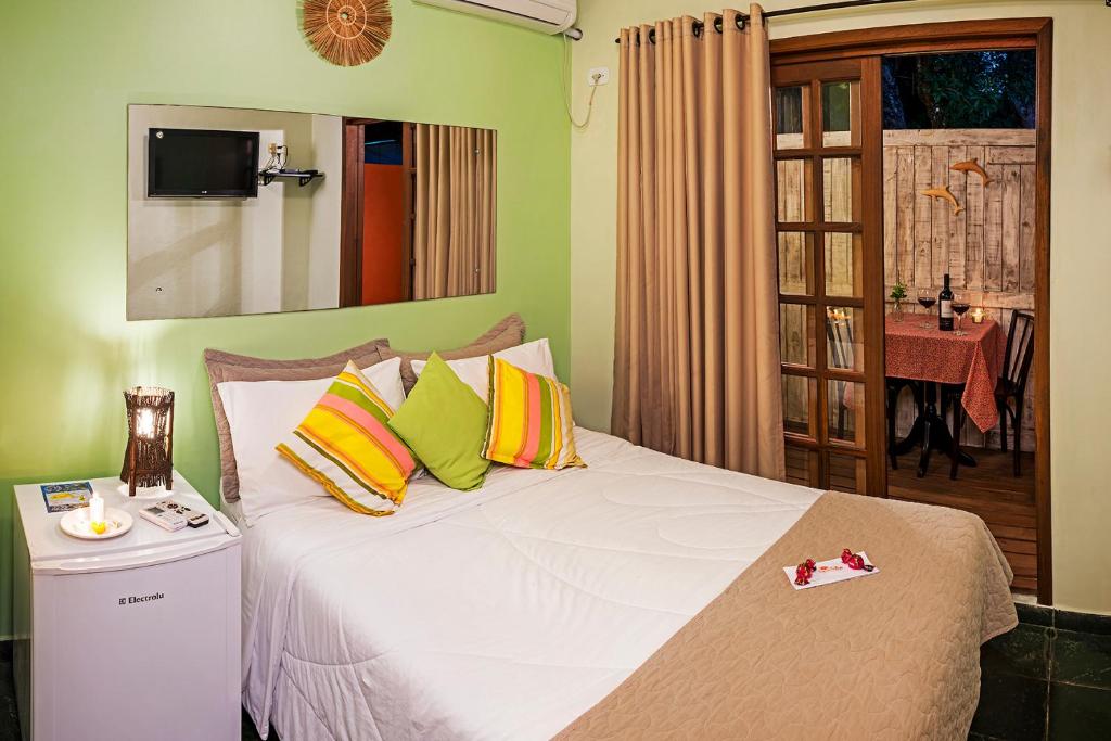 Cama ou camas em um quarto em Pousada e Restaurante Fim da Trilha