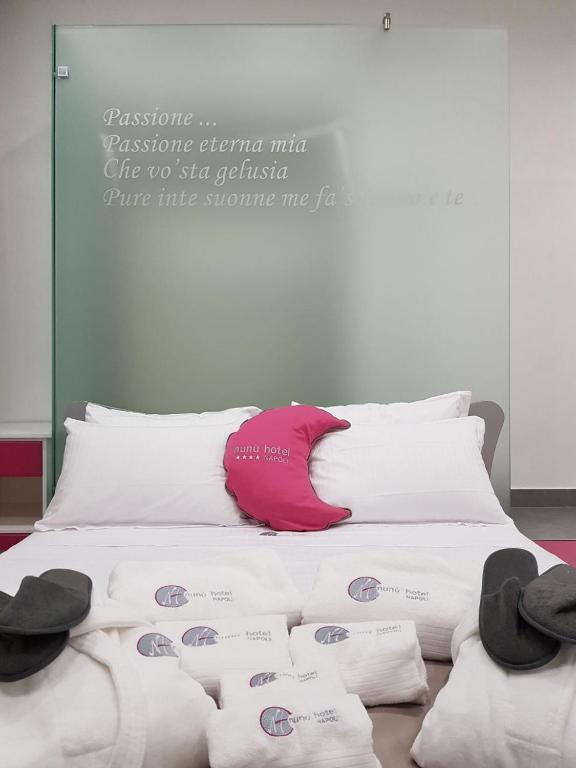 Postel nebo postele na pokoji v ubytování Hotel Nunù