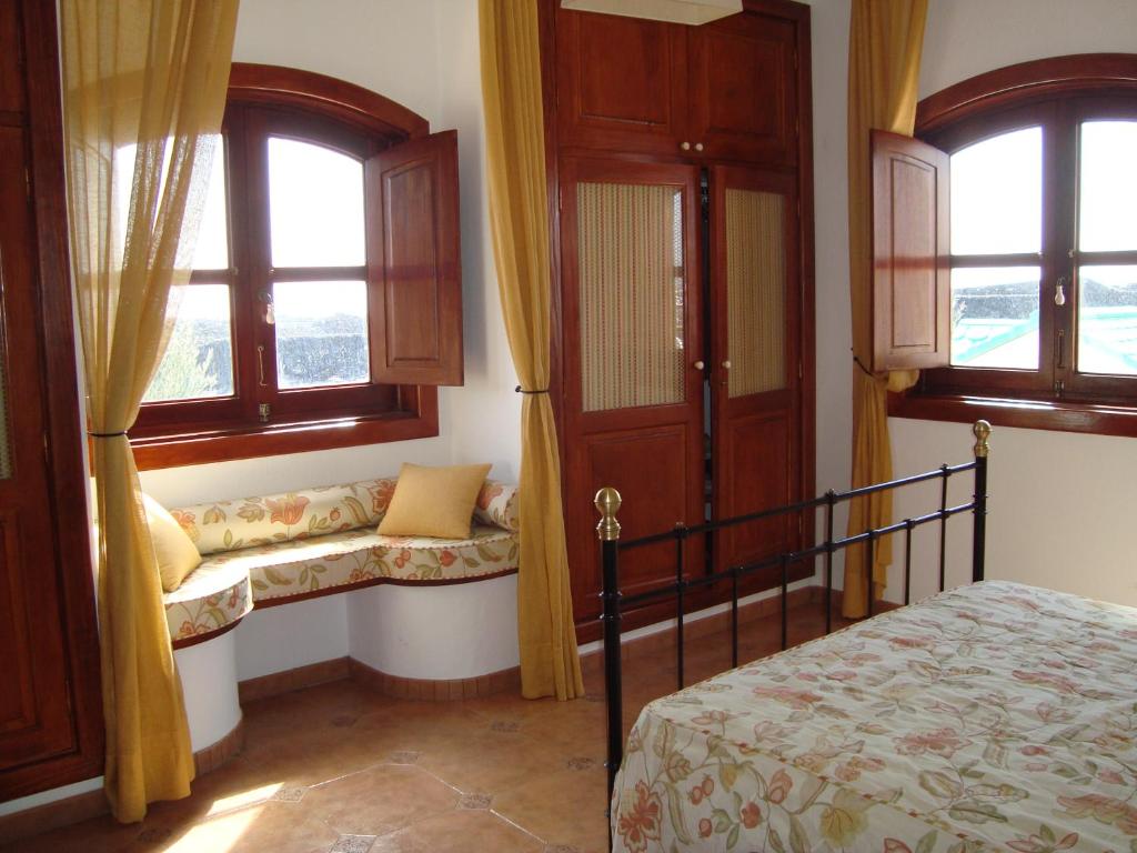 Postel nebo postele na pokoji v ubytování Villas Macher