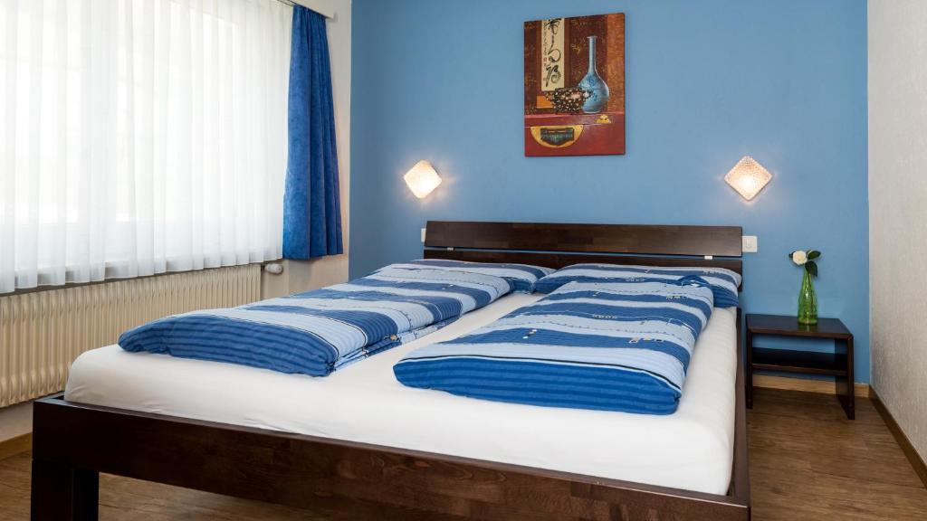 Postel nebo postele na pokoji v ubytování Haus Aristella