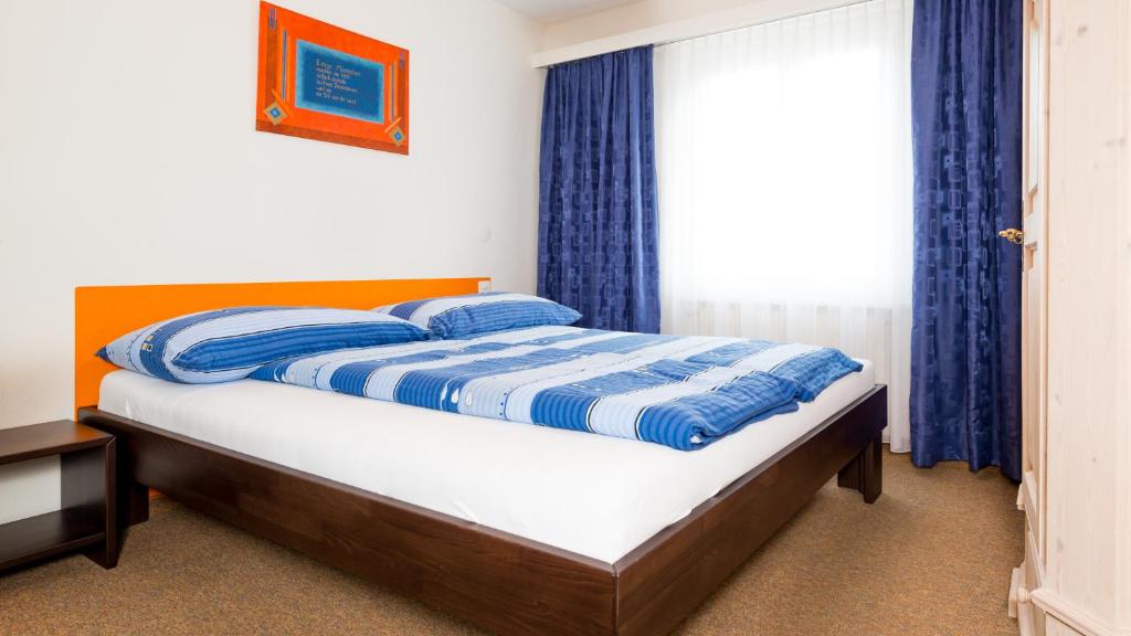 Postel nebo postele na pokoji v ubytování Haus Aristella