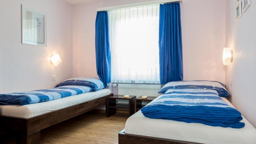 Postel nebo postele na pokoji v ubytování Haus Aristella