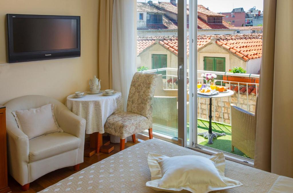 Postel nebo postele na pokoji v ubytování Royal Suites