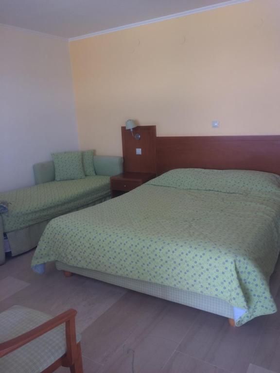 Postel nebo postele na pokoji v ubytování Artemis