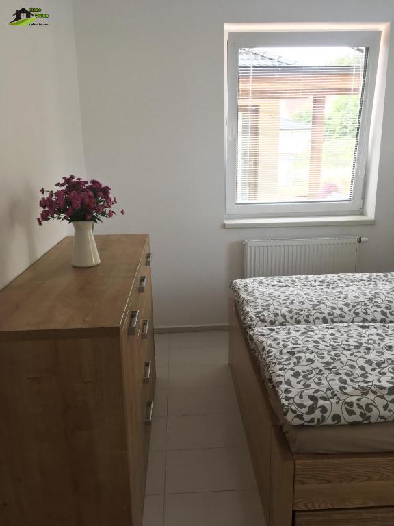 Łóżko lub łóżka w pokoju w obiekcie Lipno Vision Apartments