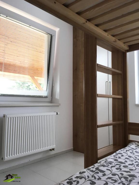 Łóżko lub łóżka w pokoju w obiekcie Lipno Vision Apartments