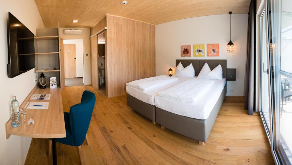 Posteľ alebo postele v izbe v ubytovaní Hotel Katamaran