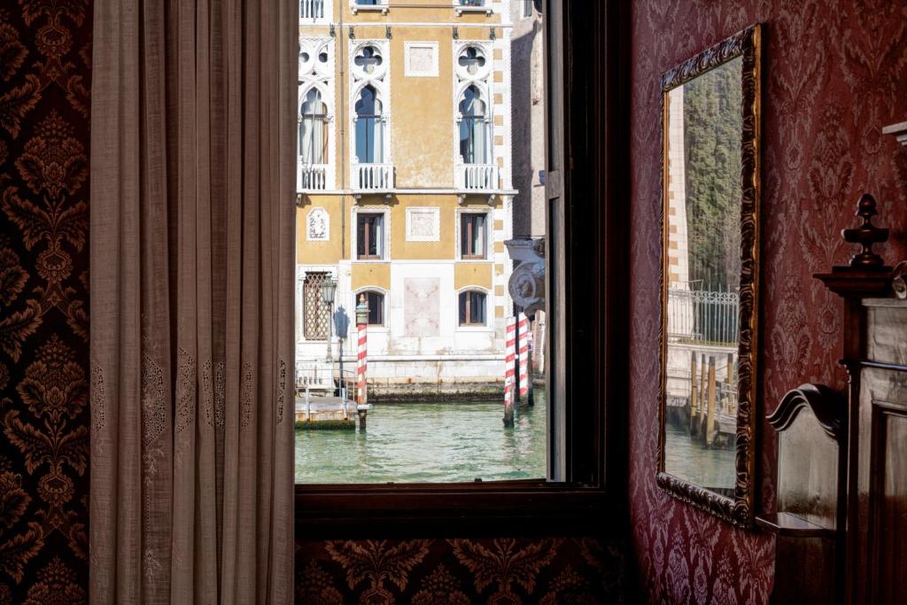 a view of a canal from a window of a building at Hotel Galleria in Venice