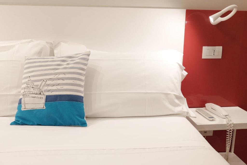 Postel nebo postele na pokoji v ubytování Hotel Aurea