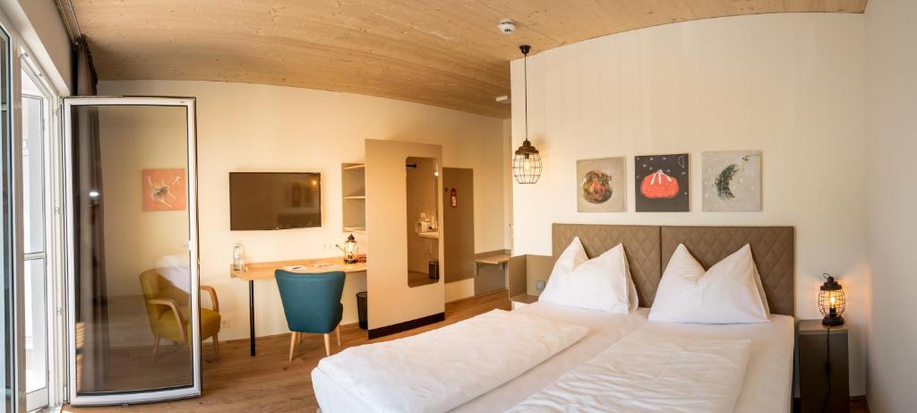 Posteľ alebo postele v izbe v ubytovaní Hotel Katamaran