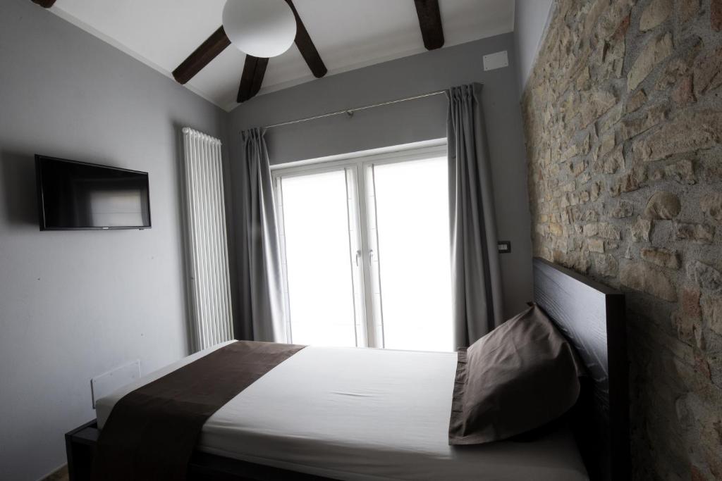 Postel nebo postele na pokoji v ubytování Villa Barbero Alba Langhe
