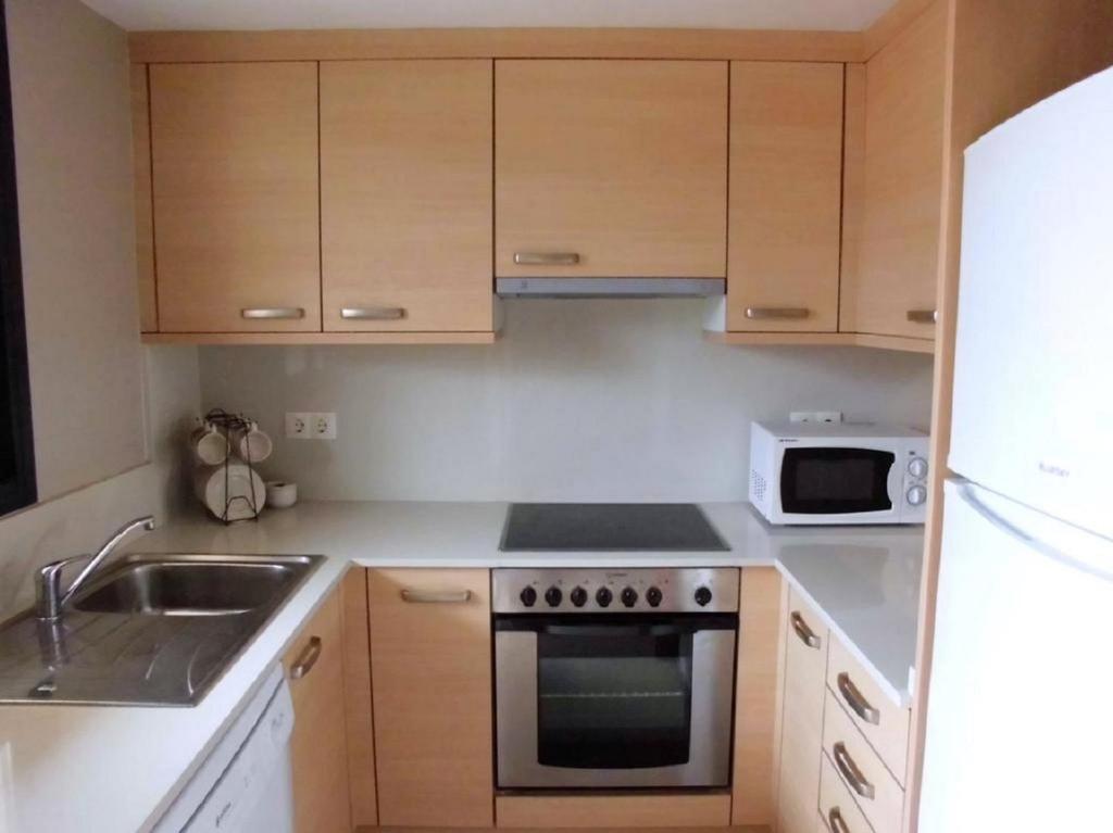 Kuchyň nebo kuchyňský kout v ubytování Residencial La Cala