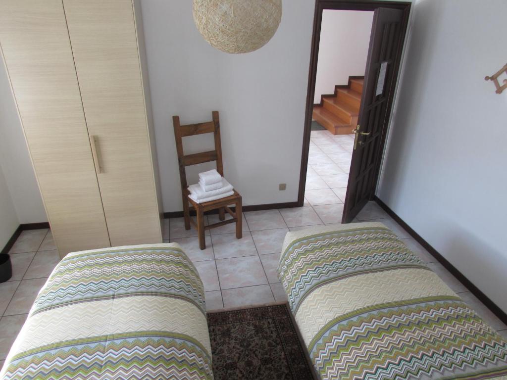 Postel nebo postele na pokoji v ubytování B&B Carunei