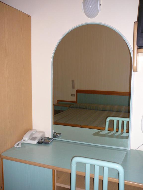 Postel nebo postele na pokoji v ubytování Hotel De La Plage