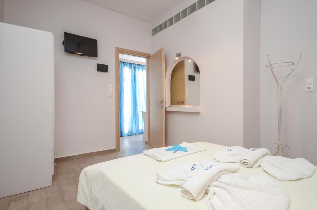 Postel nebo postele na pokoji v ubytování Filippa Studios