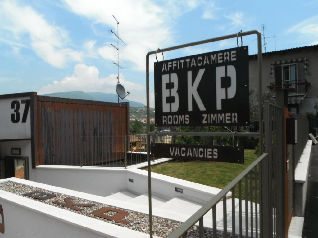 a sign on the balcony of a building at Bikapi in Garda