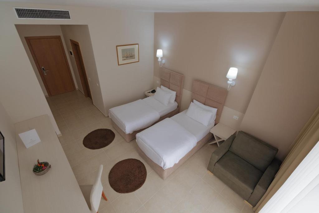 Postel nebo postele na pokoji v ubytování Horizont Hotel