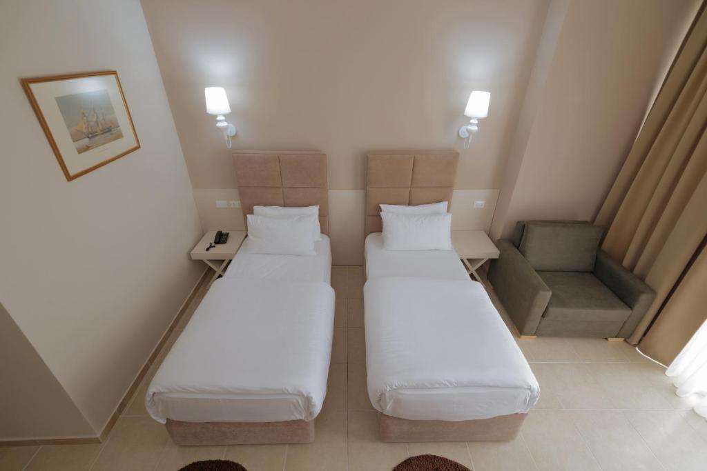 Postel nebo postele na pokoji v ubytování Horizont Hotel