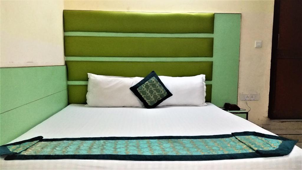 Postel nebo postele na pokoji v ubytování Hotel Kwality