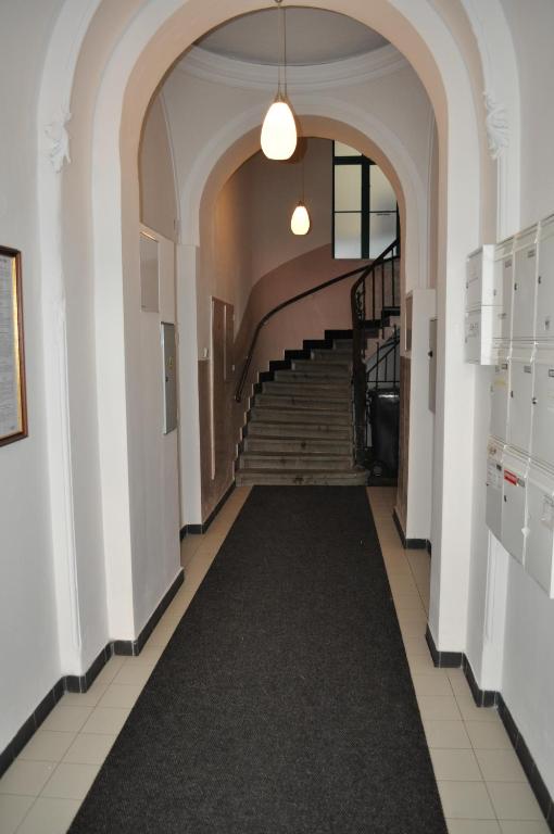 a hallway with a staircase in a building at Apartment Josef in Prague