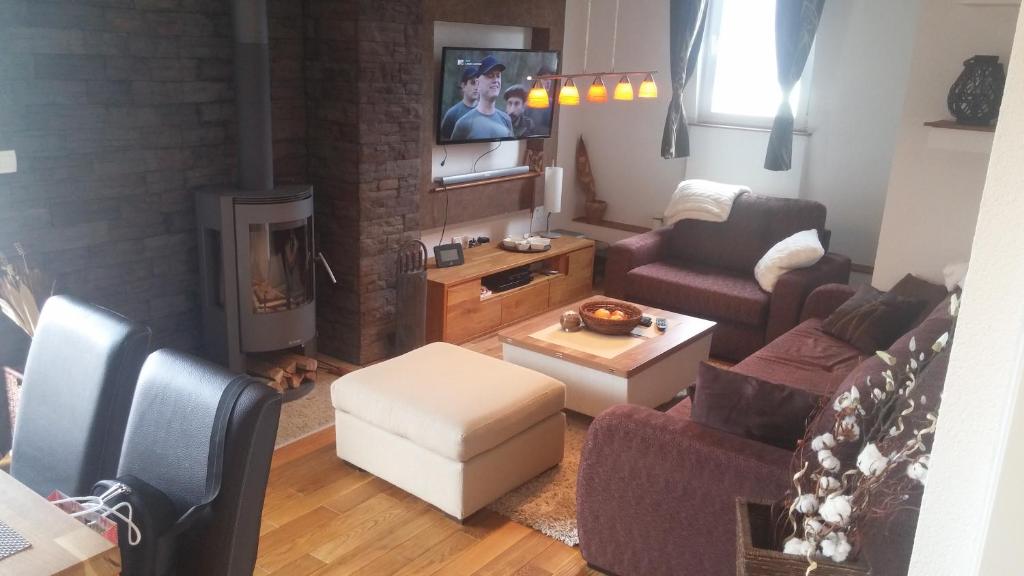 an aerial view of a living room with a fireplace at Apartman Ena in Vlasic